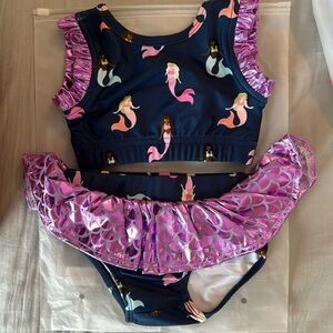 Smocked sweets, two piece mermaid bathing suit 12 months. New in bag.